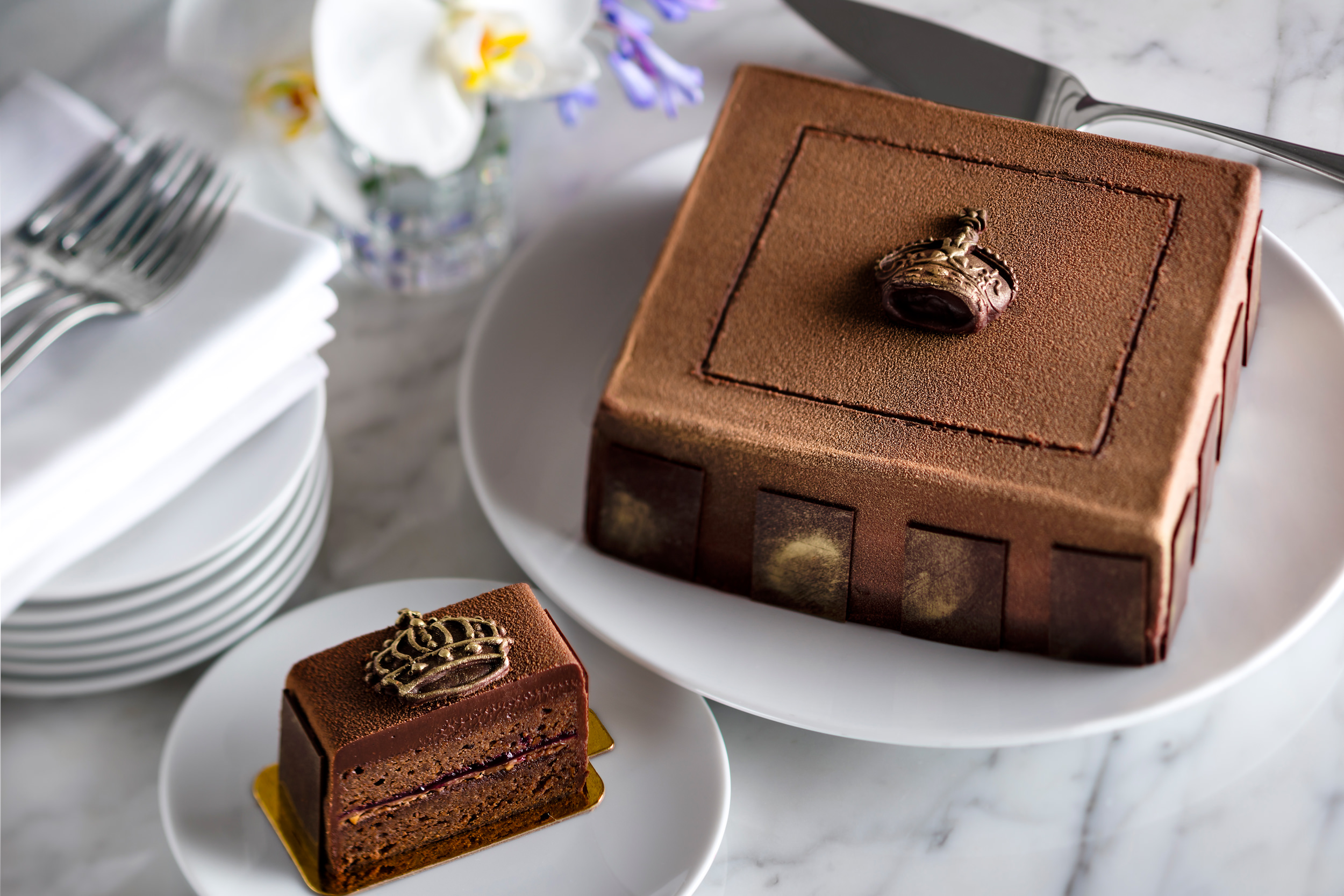 close up of a chocolate cake with crown decoration