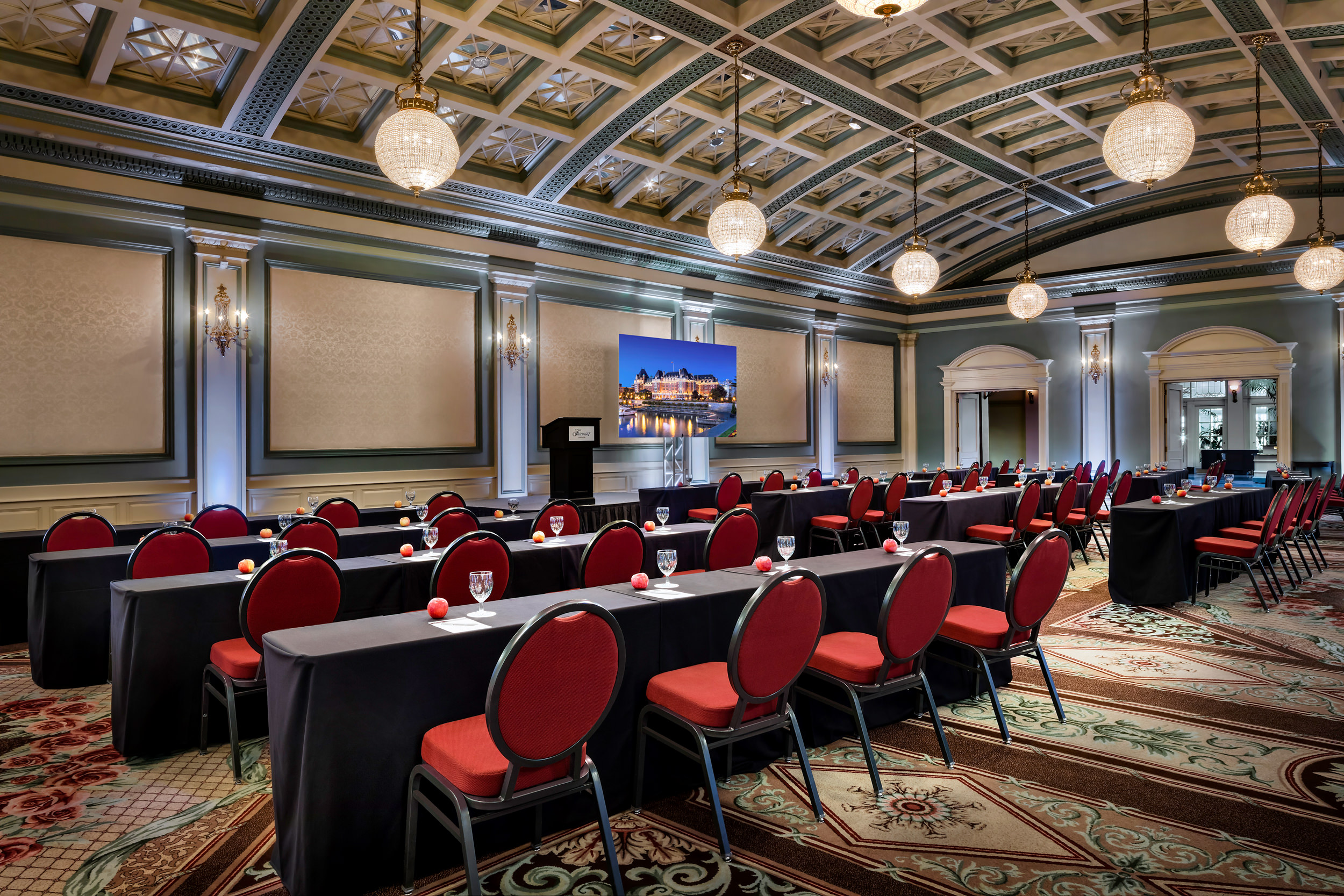 large room set up with rows of tables