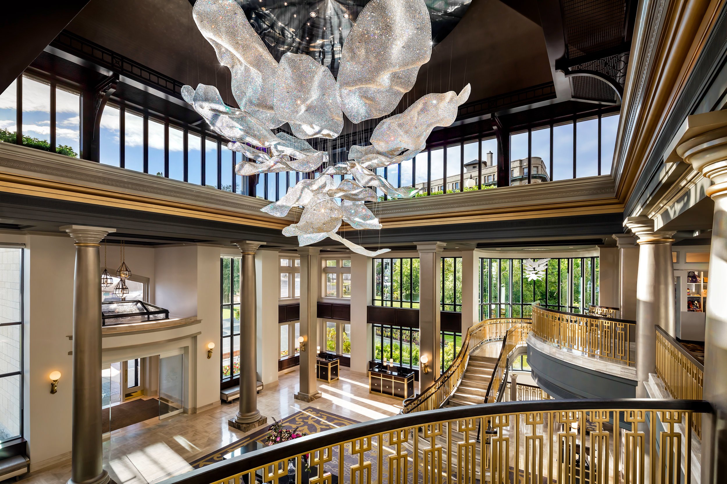 brightly-lit hotel lobby with gold accents