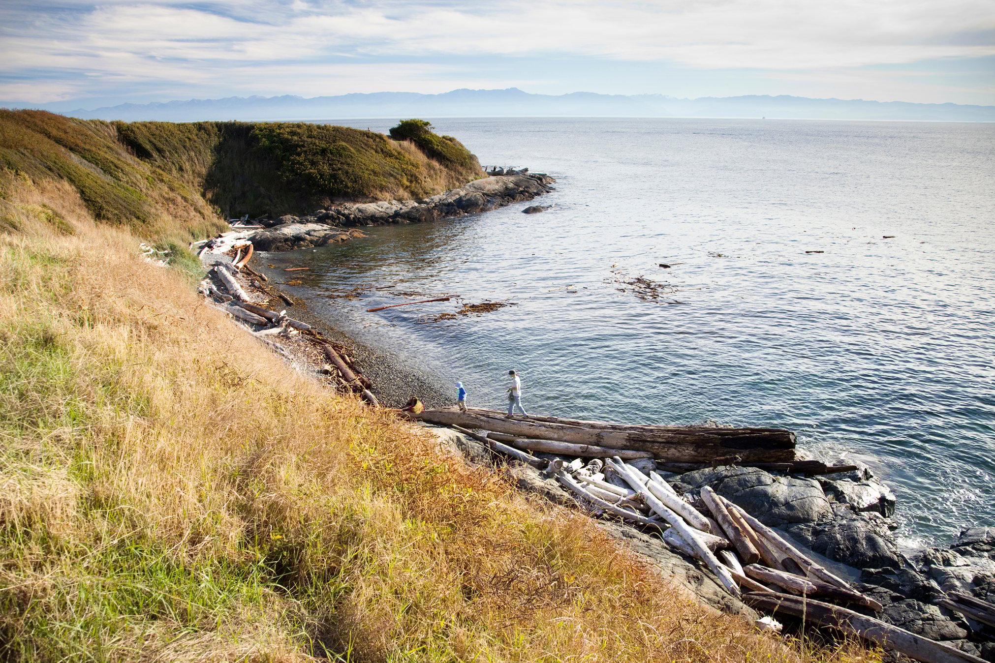 tourists walking along a shoreline