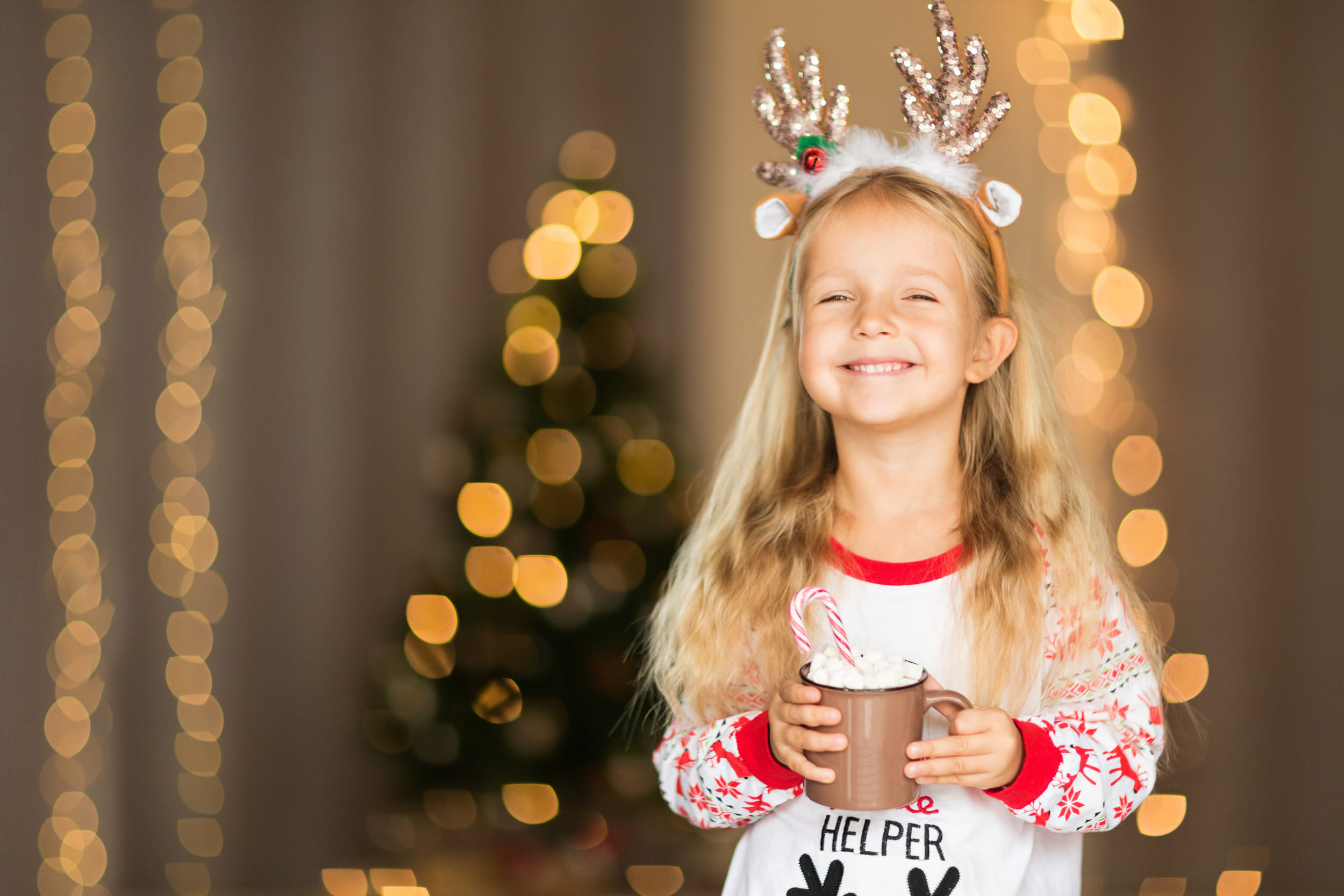 little girl drinking hot chocolate