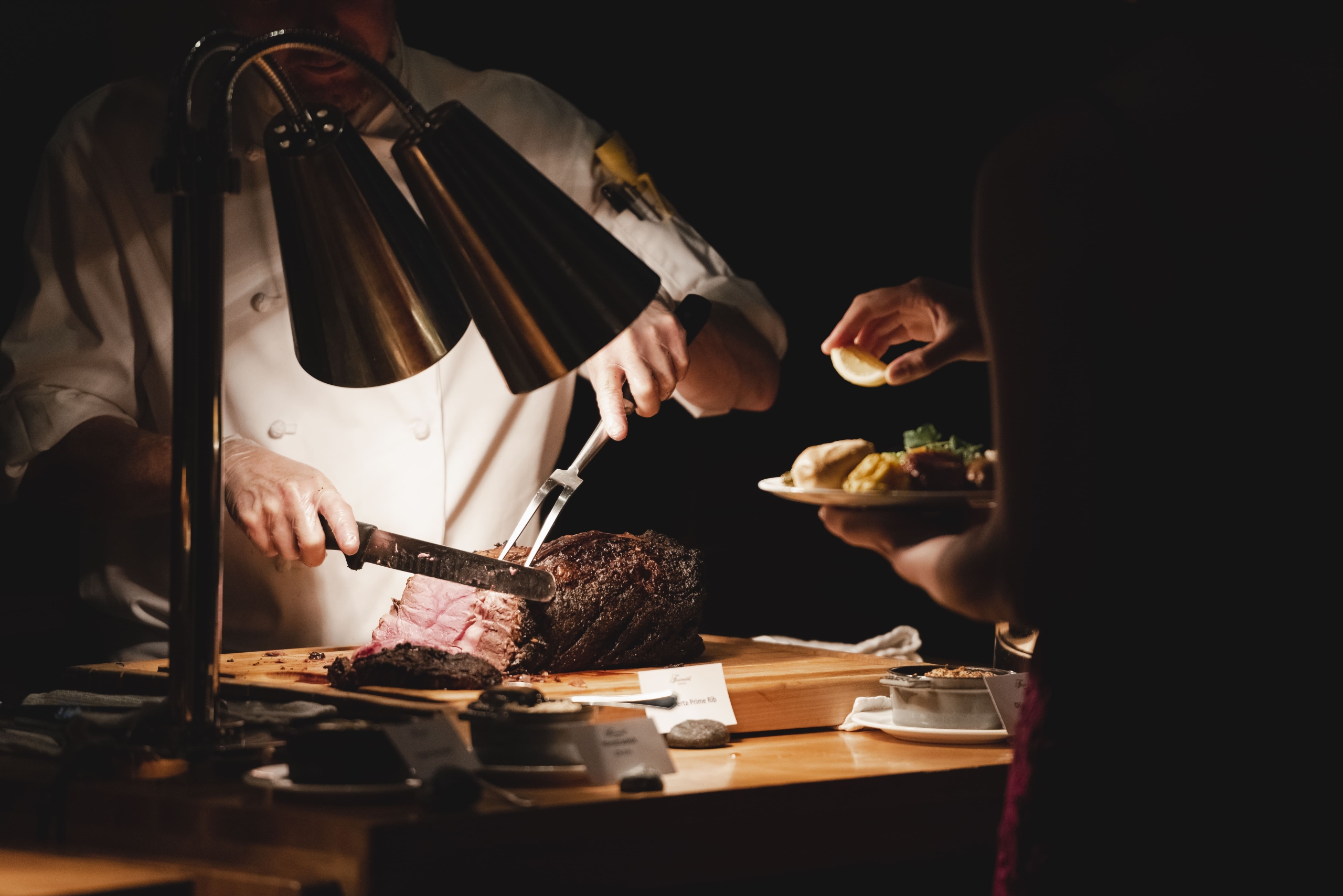 man cutting meat