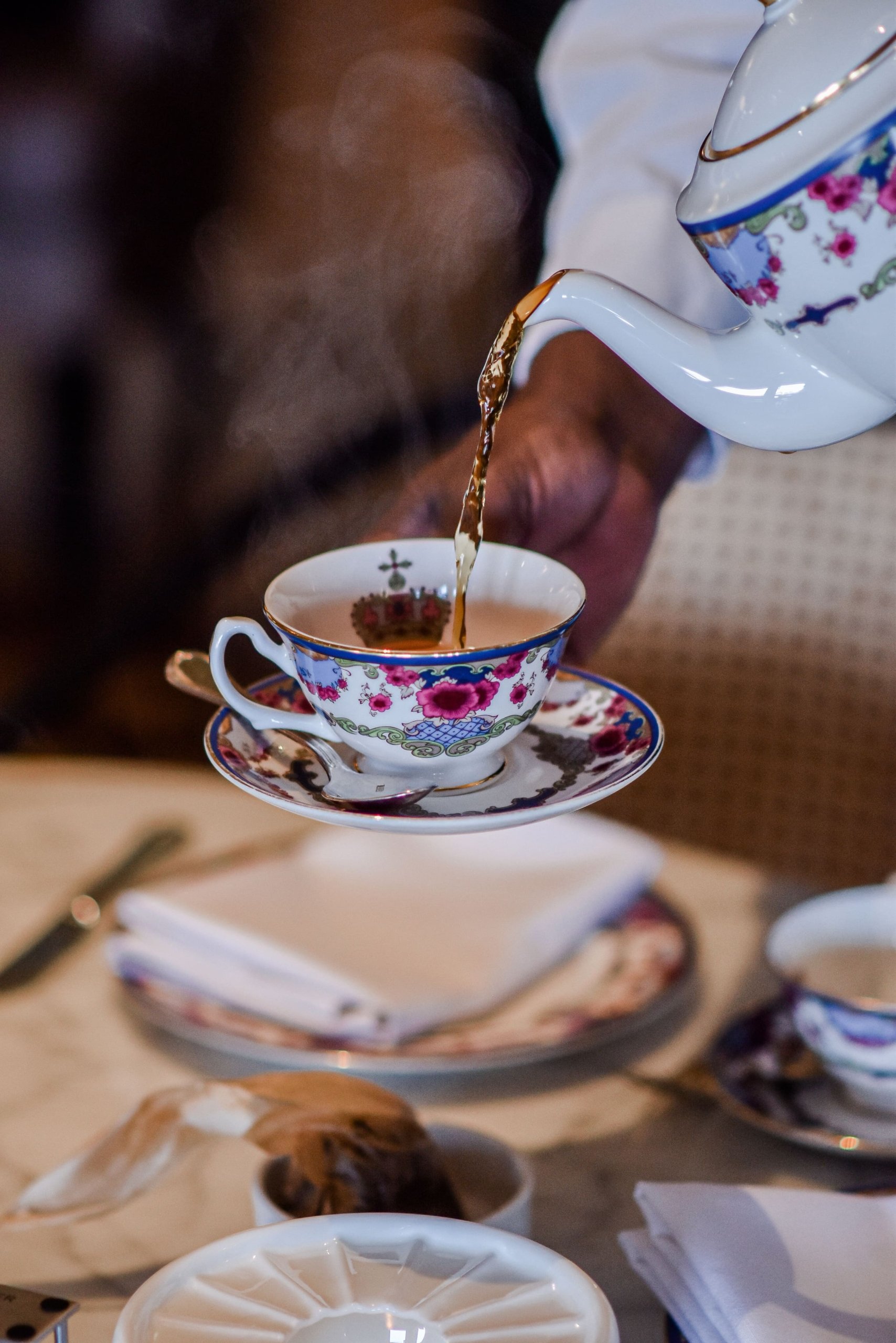tea being poured into a tea cup